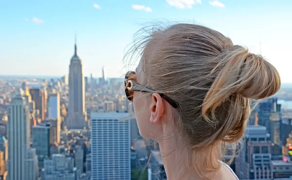 Girl looking at the Empire State Building on August 5, 2010 in New York, USA