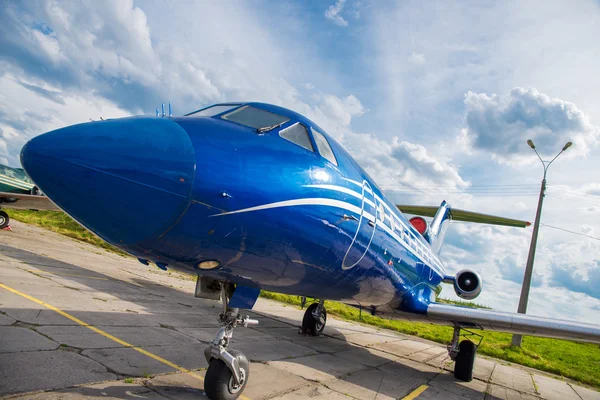 Blue plane in the parking lot