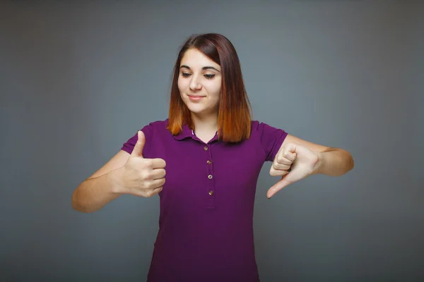 Girl showing sign of yes and no fingers