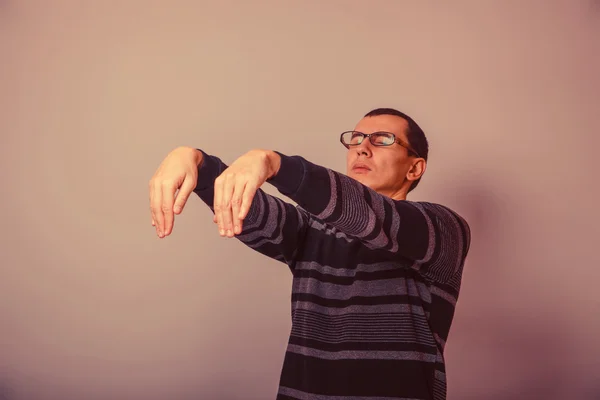 European-looking man of 30 years in  glasses  wants to sleep, sl