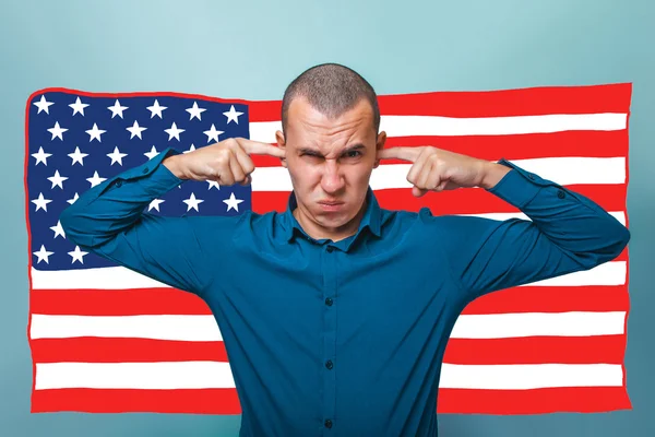 Businessman a man put his fingers in his ears angry American fla