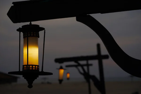 Lantern at night on the beach