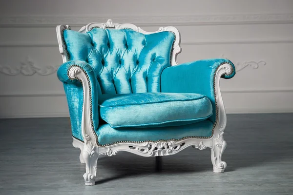 Blue armchair in the room