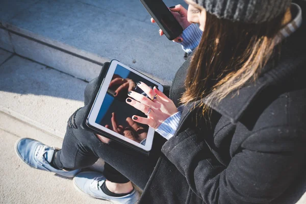 Young woman tapping the screen