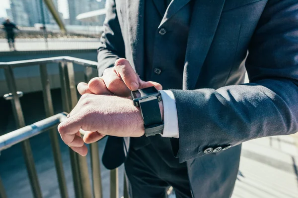 Businessman using smart watch