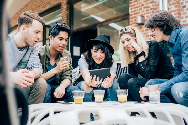 Friends sitting in bar having drink