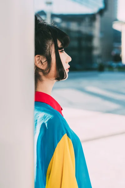 Asian millennial woman in city