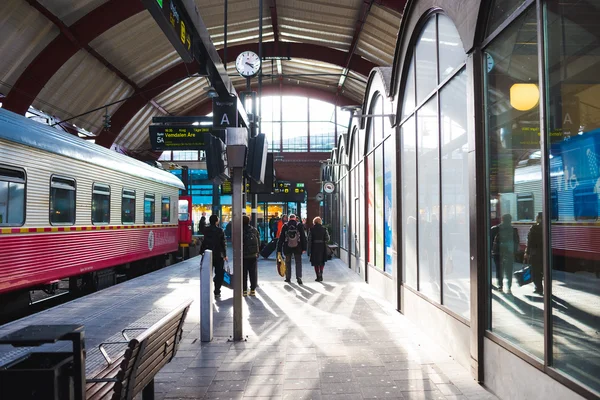 People walking in train station