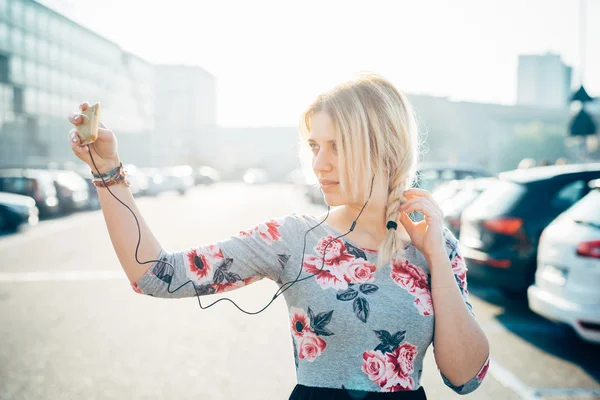 Woman listening music with earphones
