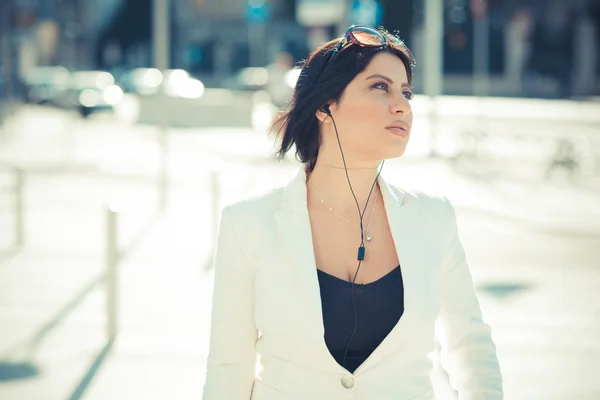 Beautiful long black hair elegant business woman with earphones