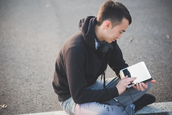 Young asian man listening music