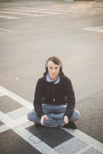 Young asian man listening music