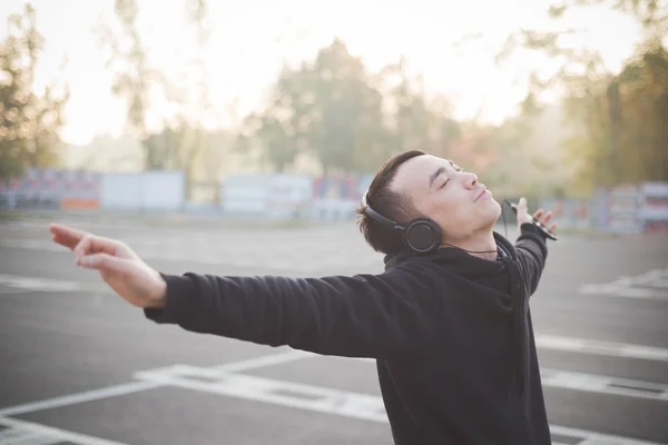 Funny asian man listening music