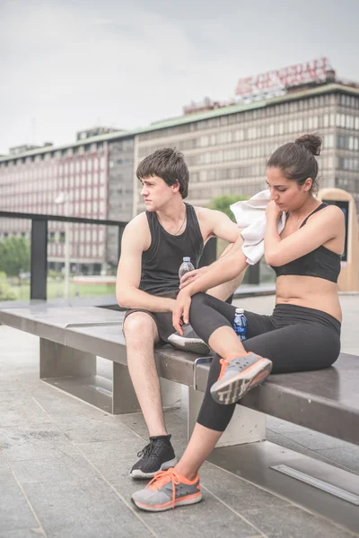 Young handsome sportive man and woman