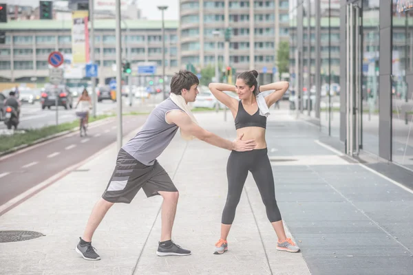 Young handsome sportive man and woman