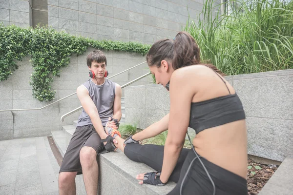 Young handsome sportive man and woman