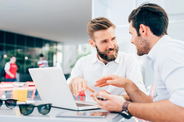 Modern businessmen using laptop