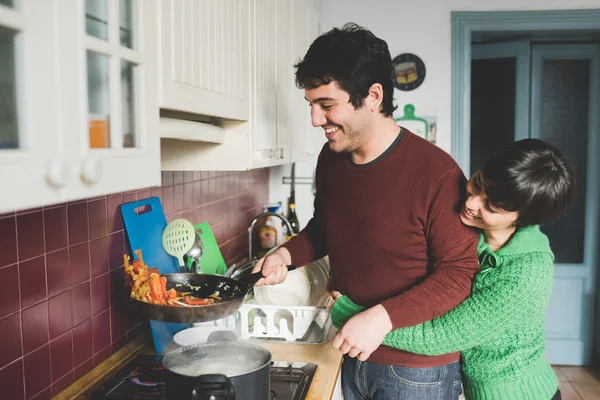 Man and woman couple cooking together