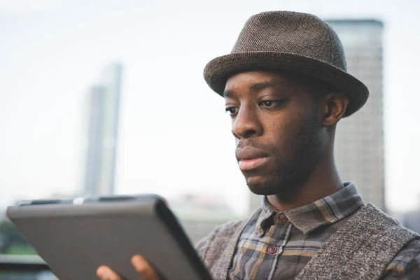 Afro black man using a tablet