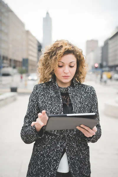 Contemporary businesswoman using a tablet