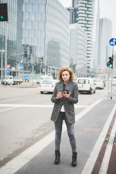 Businesswoman walking through the streets