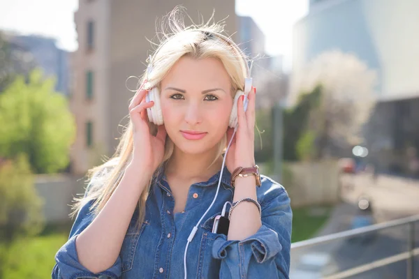 Blonde girl listening to music