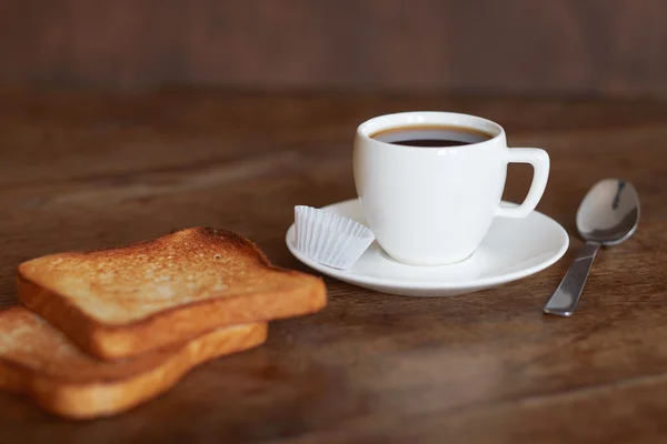 A cup of coffee and toast.