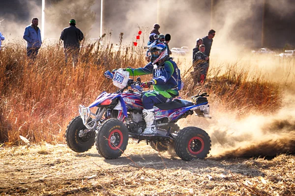 HD- Quad Bike kicking up trail of dust on sand track during rall