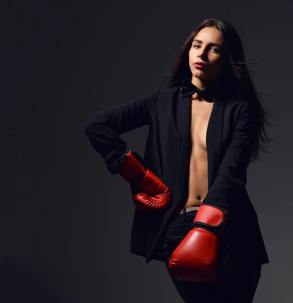 Beautiful sexy woman with red Boxing Gloves at the gym concept a