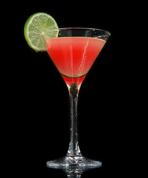 Red strawberry cocktail decorated with lime in martini