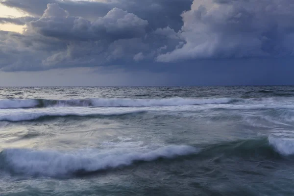 Stormy sky over the wave of the sea. Israel