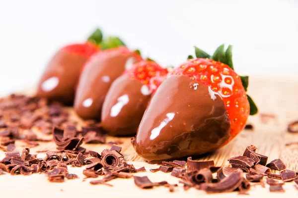 Ripe strawberries dipped in chocolate.