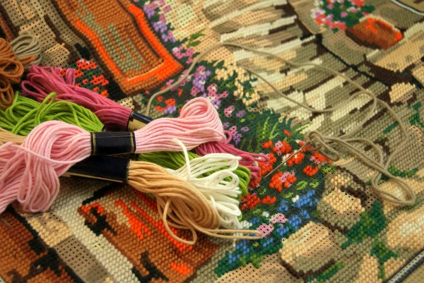 Colored thread on an embroidered tapestry