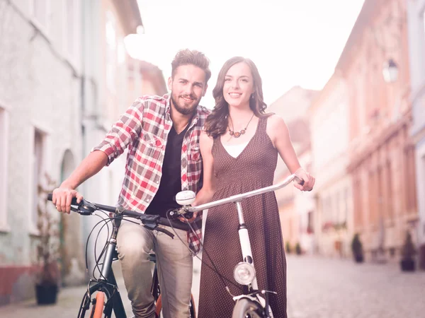 Beautiful young couple with bicycle