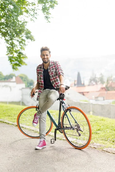 Handsome man with a city bike