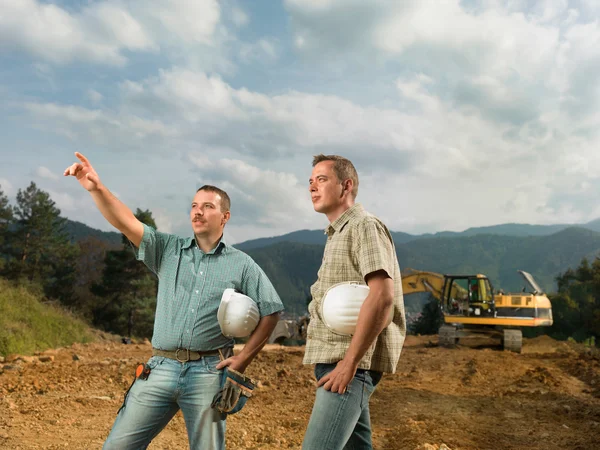 Engineers supervising construction in progress