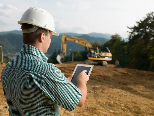 Architect checking plan on tablet