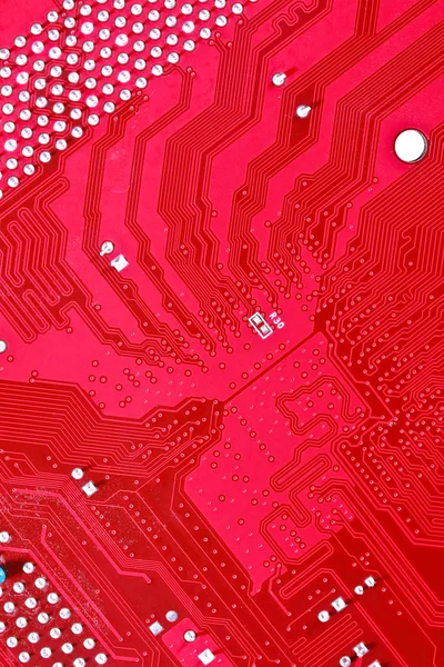 Red circuit board texture background of computer motherboard