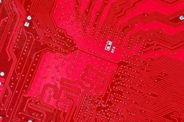 Red circuit board texture background of computer motherboard