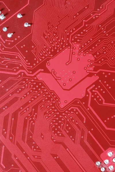 Red circuit board texture background of computer motherboard