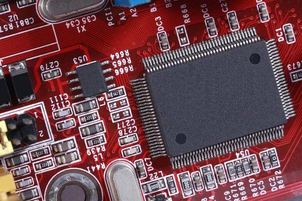 Close-up of electronic circuit red board with processor of compu