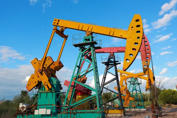 Golden yellow and pink Oil pump of crude oilwell rig