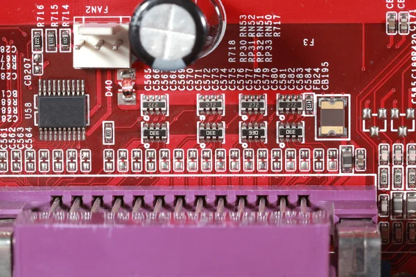 Close-up of electronic circuit red board with processor