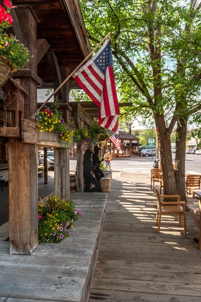 Wooden sidewalk with American flags