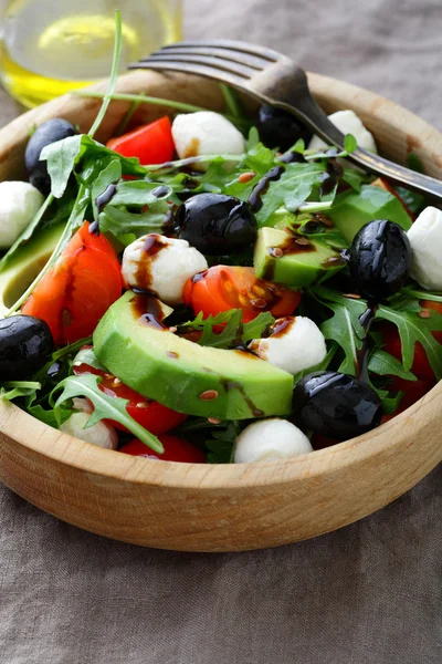 Fresh Avocado Salad with cherry tomatoes, olive, mozzarella and