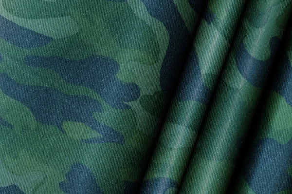 Abstract camouflage material background.