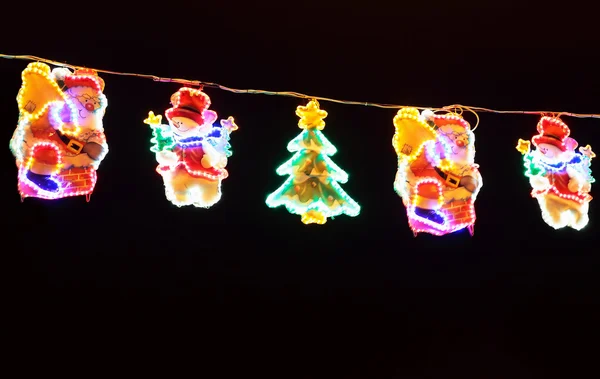 Street decorated with multicolor christmas lights