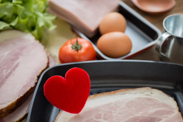 Heart in a frying pan for Love or Heart Healthy Cooking Concept,