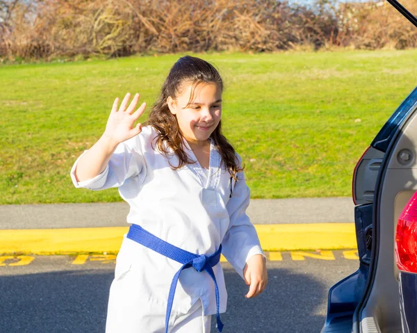 Martial Arts Student Waves Hello