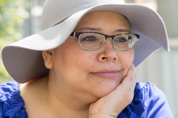 Cancer Patient Wears Hat For Sun Protection